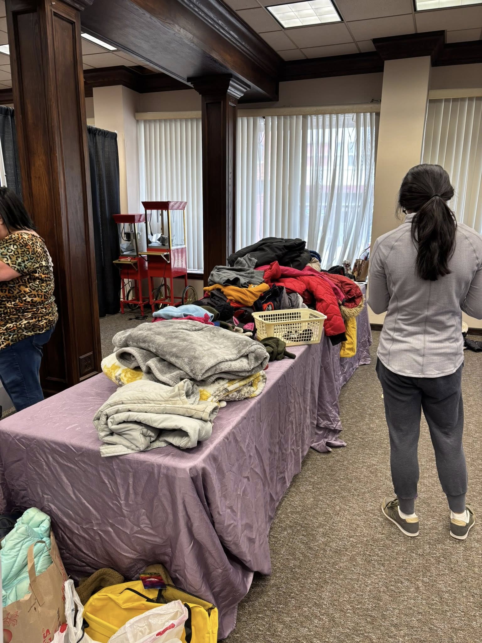 wego donation 3 Winter weather gear sorted into piles on a table